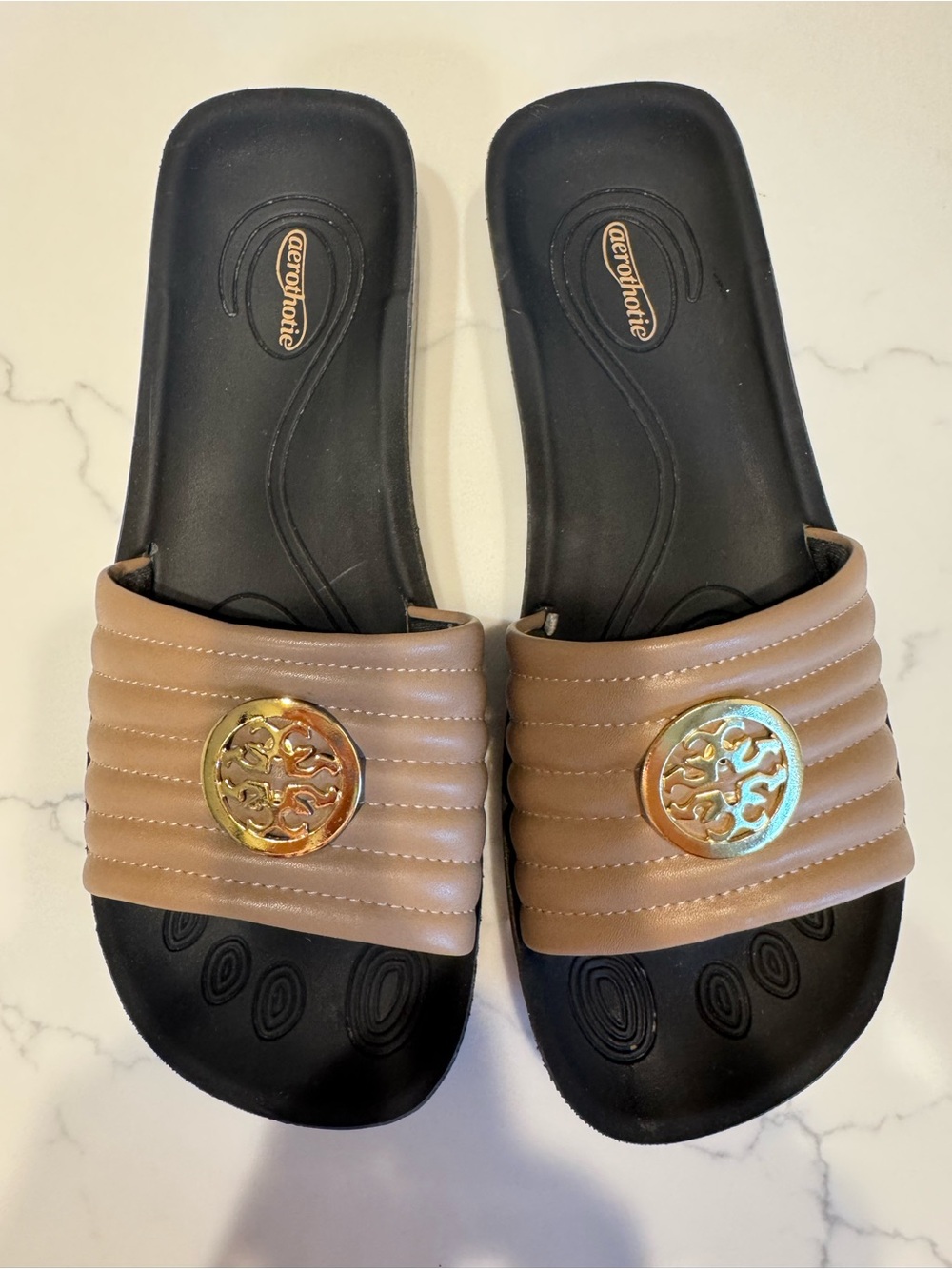 Aerothotic Tan Slide Sandals with Gold Emblem